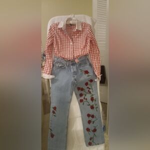 Diane Gilman Light Blue Jeans with Red Floral Embroidery. Diane was very famous.